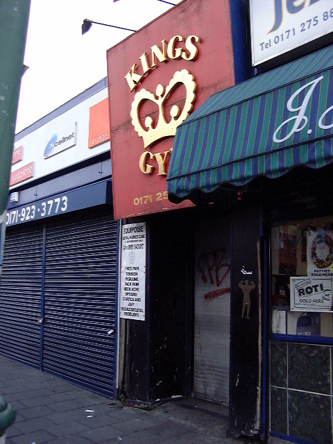 a sign that reads kings gym on the side of a store