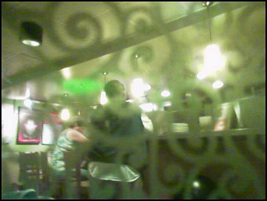 a blurry image of a man in a restaurant