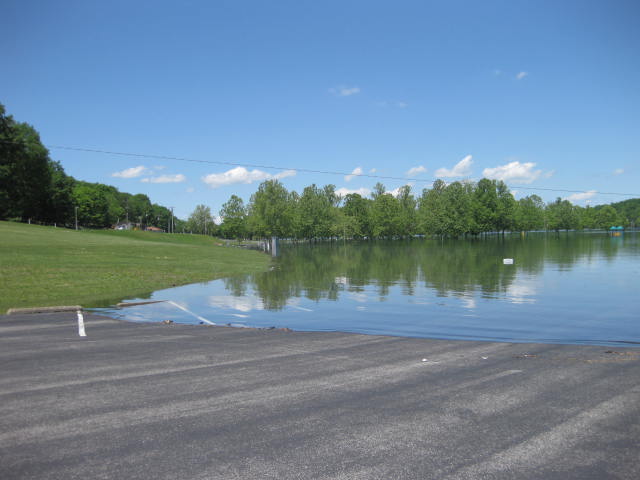 a flooded area with grass and water surrounding it