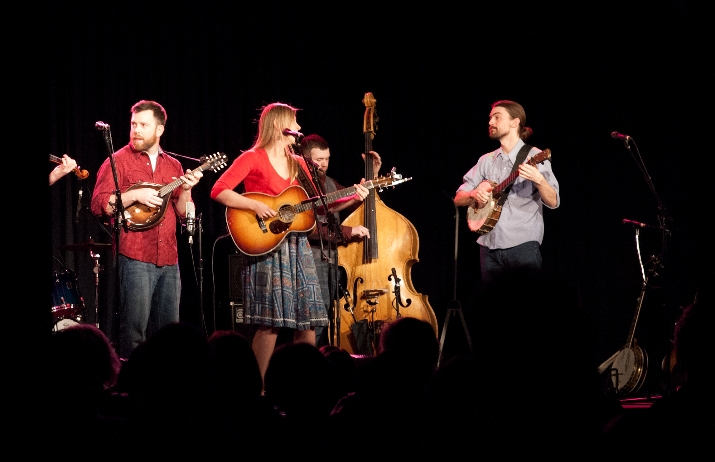 a group of people on stage playing music