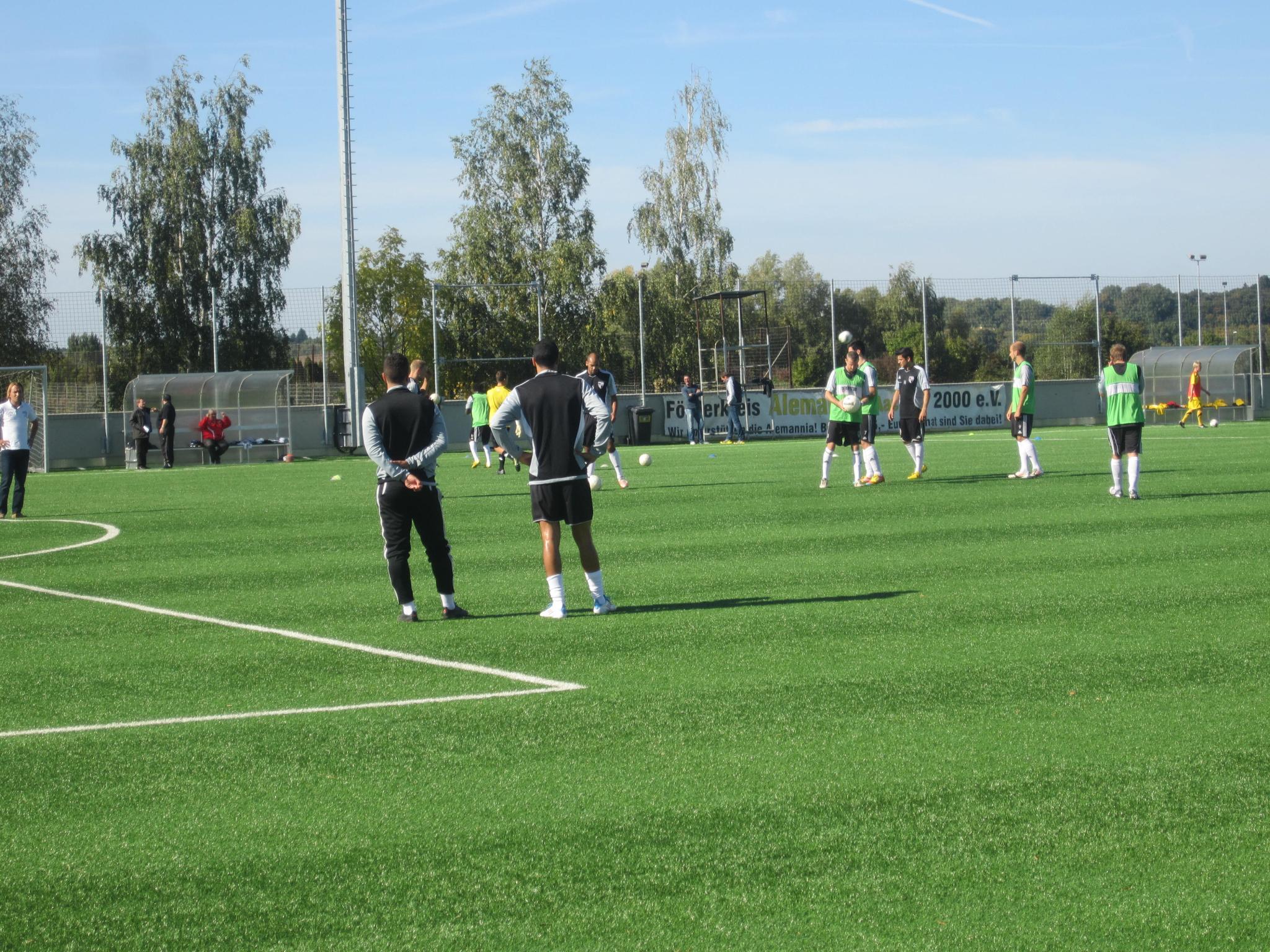 the young soccer players are practicing on the field