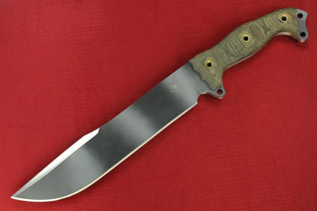 a knife lying on top of a red table cloth