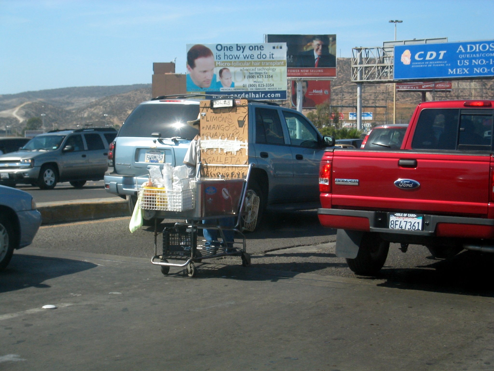a person hing a grocery cart with boxes