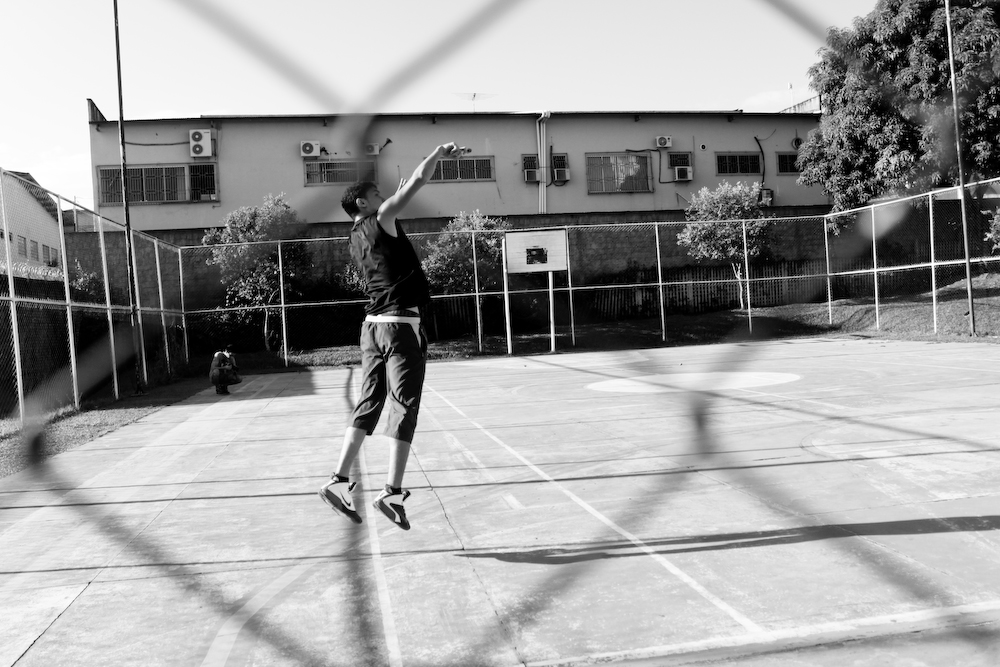 a man is on a tennis court with a ball