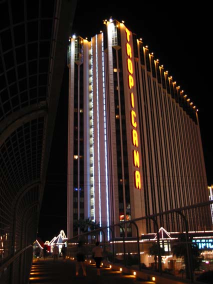 a large building with a sign lit up on top
