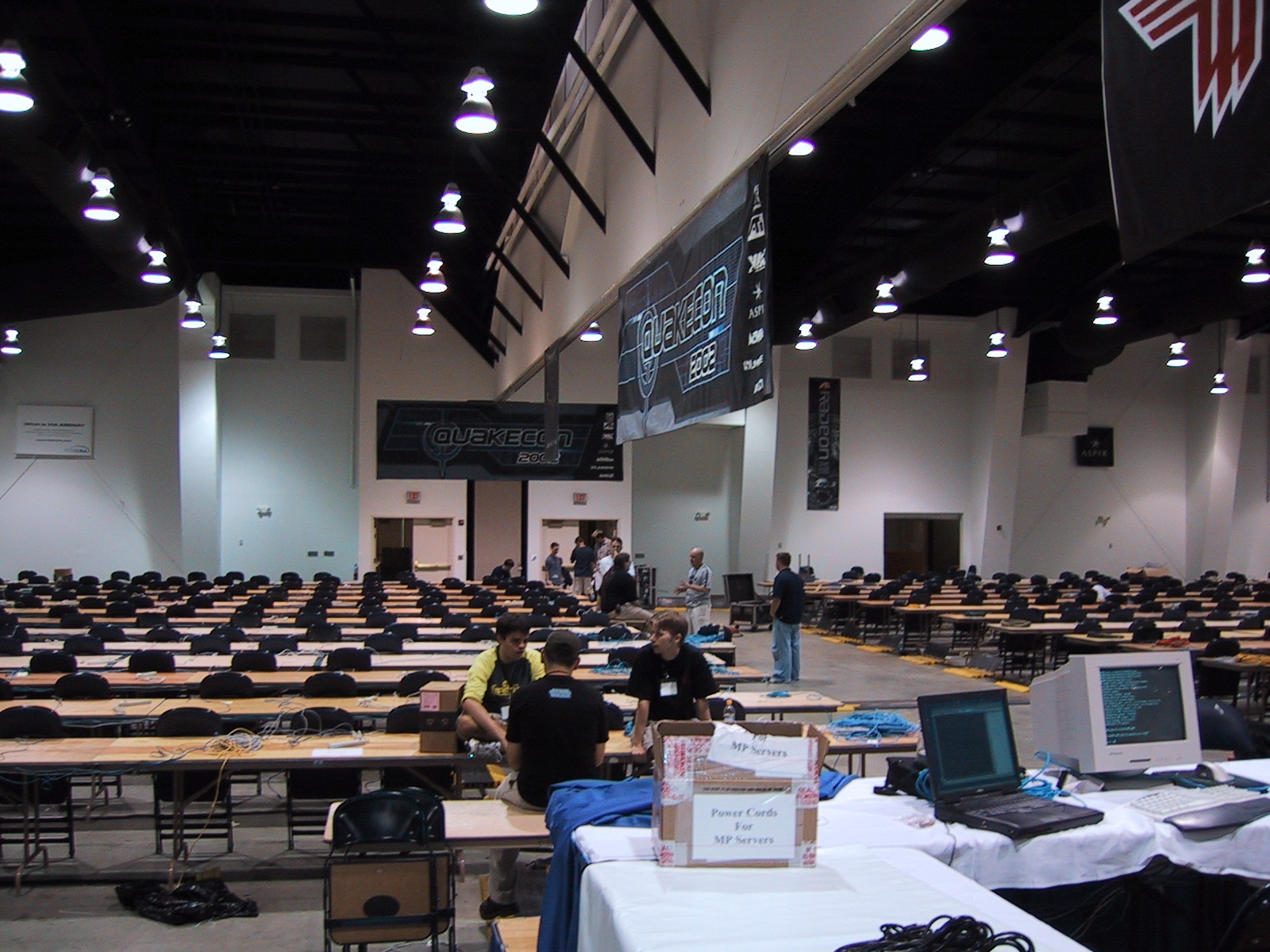 a large room with laptop computers and desks in it