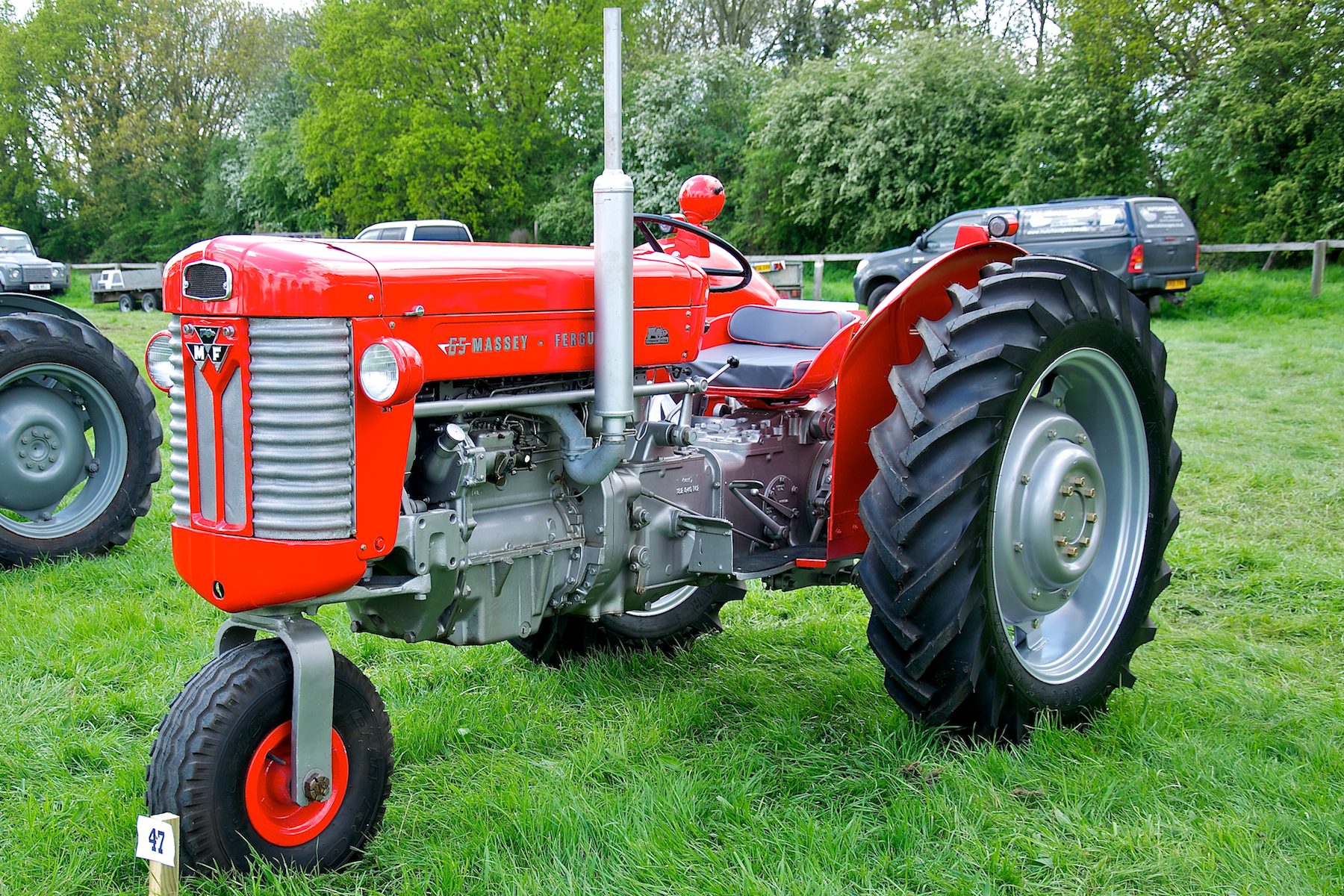 two large farm tractors parked in a field