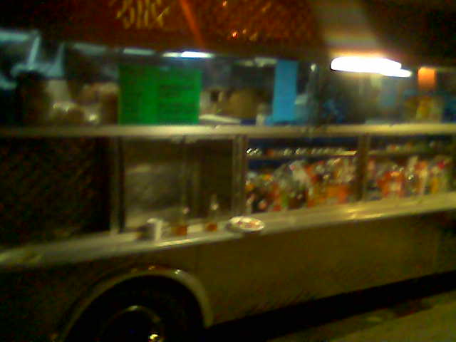 a food truck parked outside of a restaurant