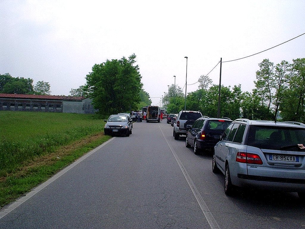 a large long street with several cars driving on it