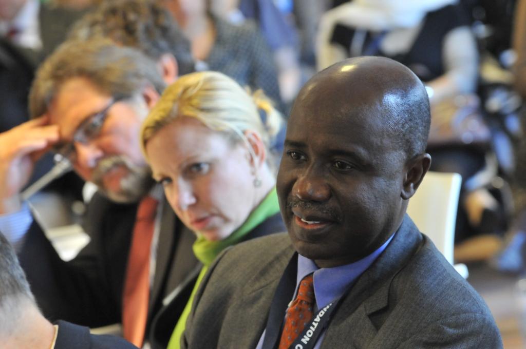 people sit together looking at each other at an event