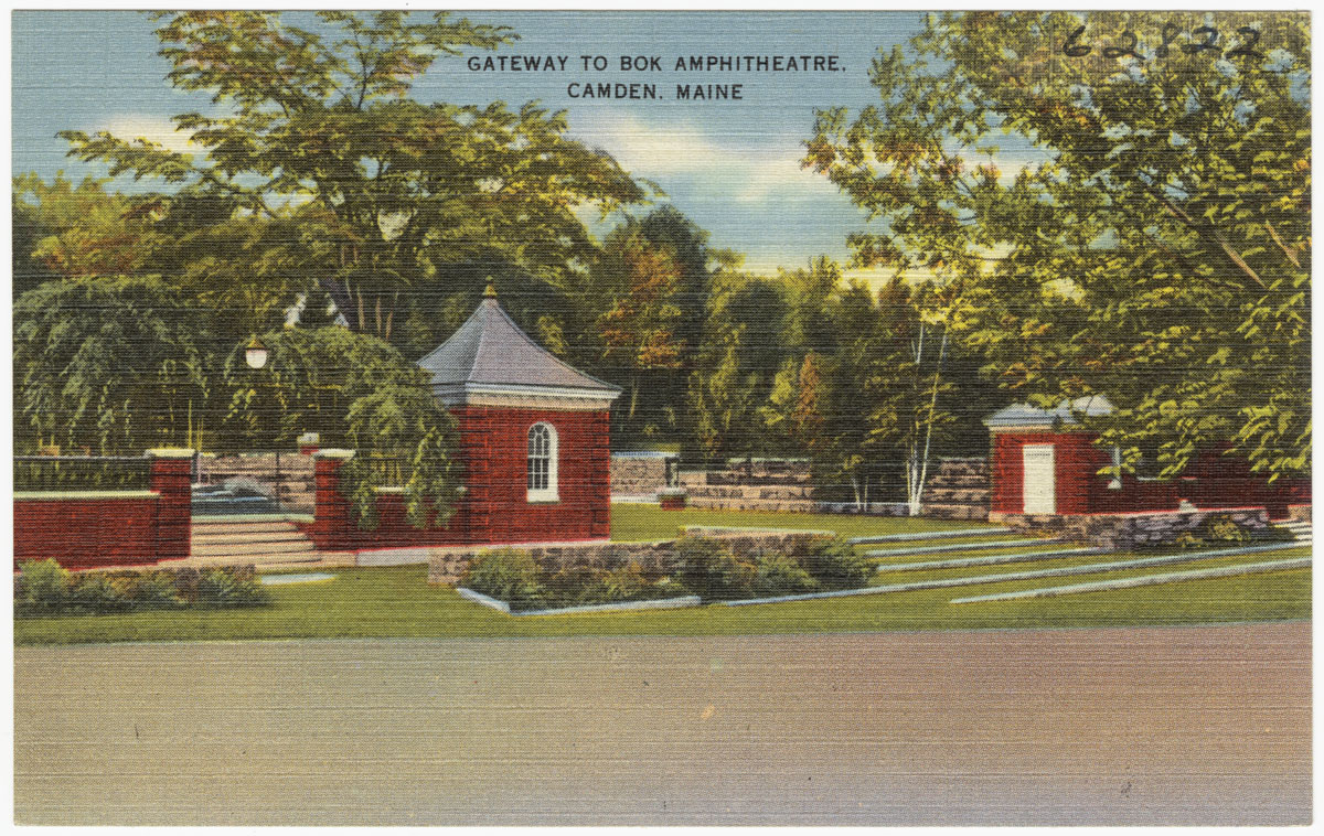 an old po of some homes with a church on the side