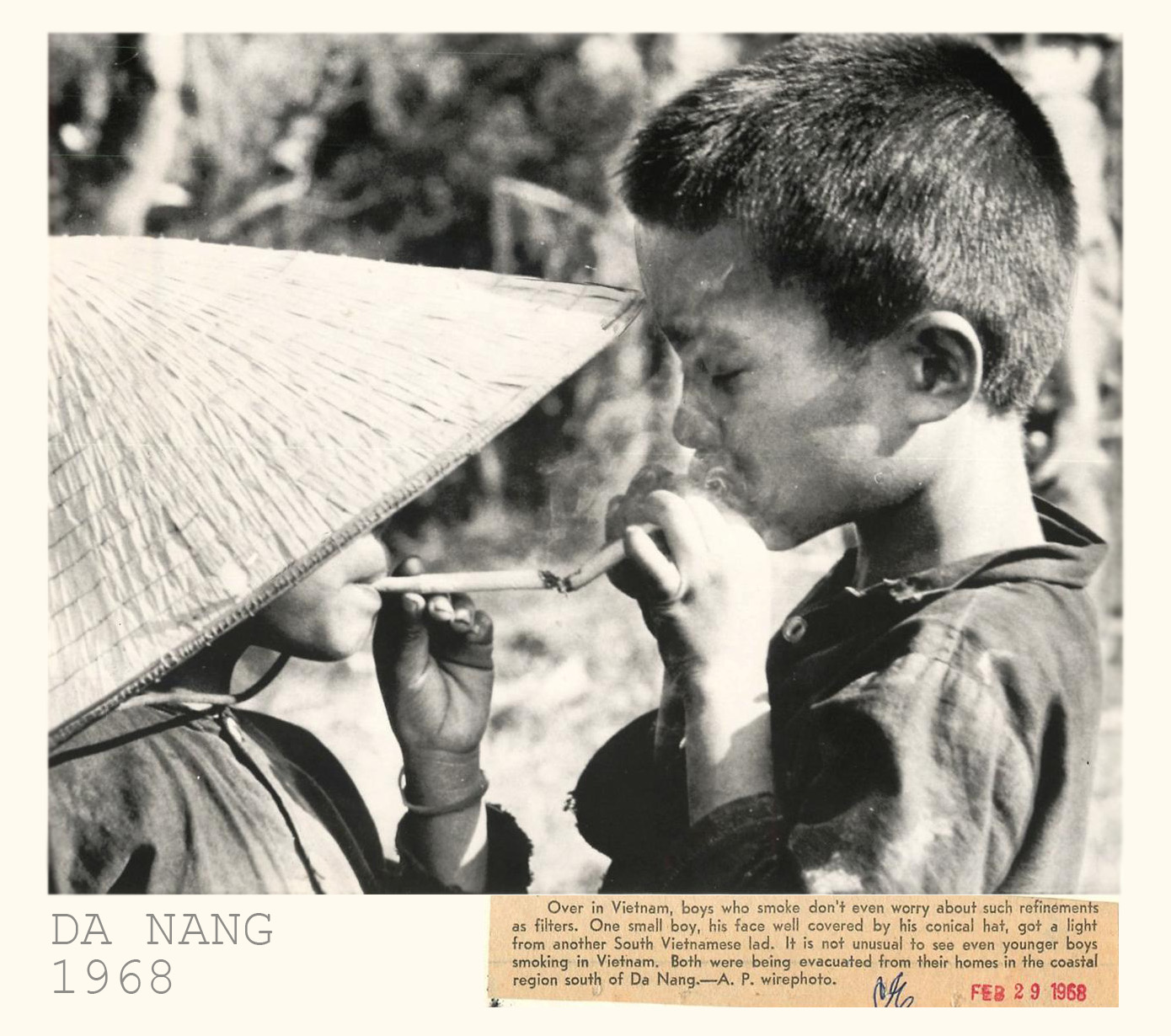 black and white pograph of boy smoking in a bamboo basket