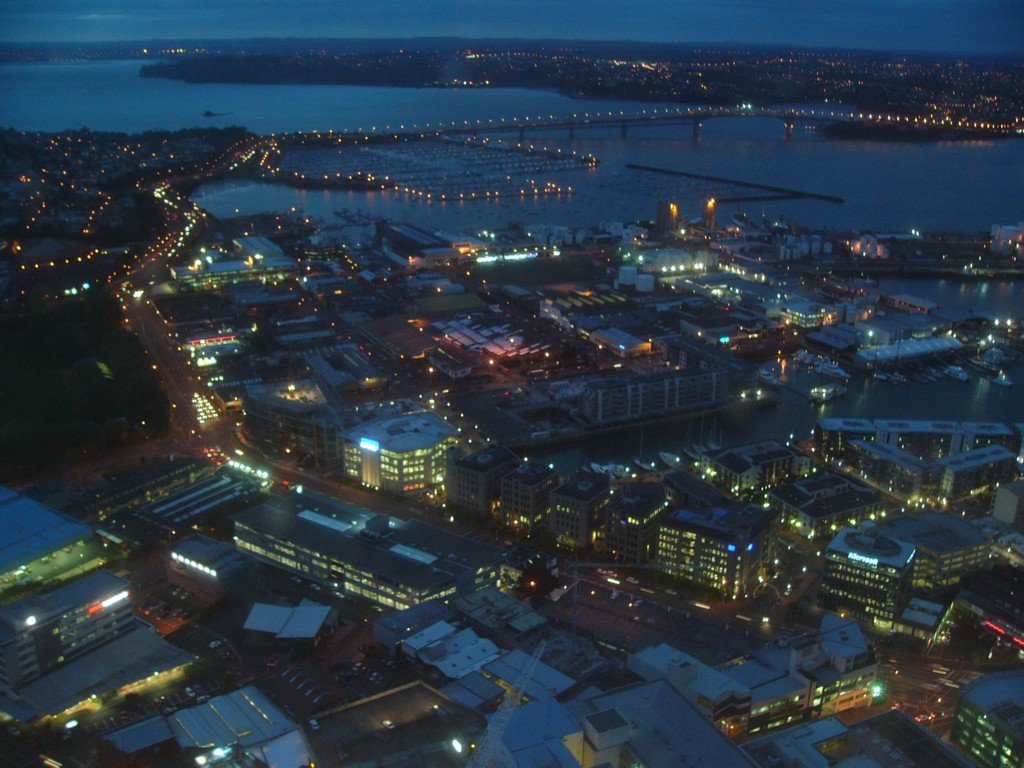 a view of the city and bay at night from a high rise