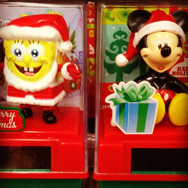 two holiday decorations are on display for christmas