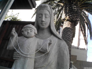 a statue of a woman holding a baby in her arms