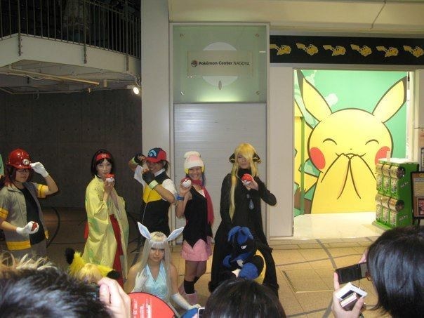 a group of people in costume posing for pictures