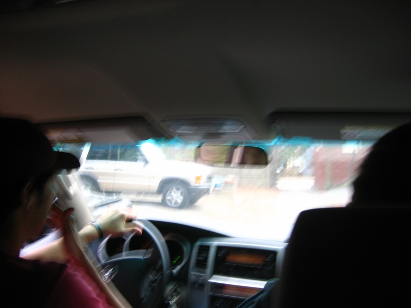 blurry s of the interior of a vehicle with a woman driving