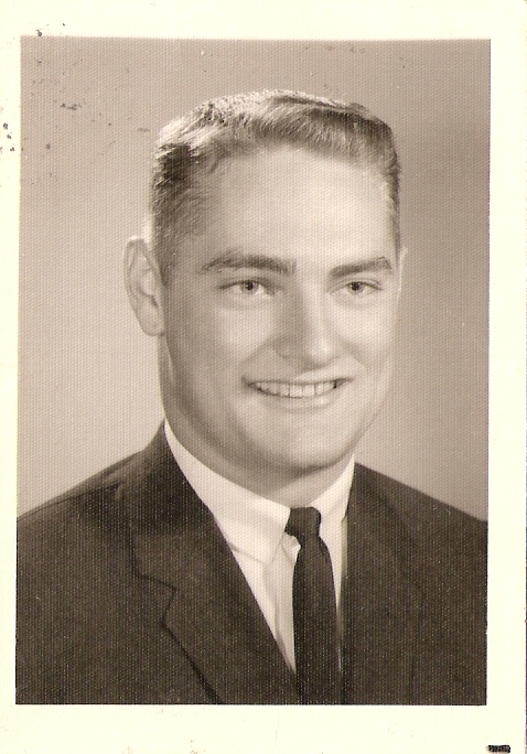 an old po of a young man smiling at the camera