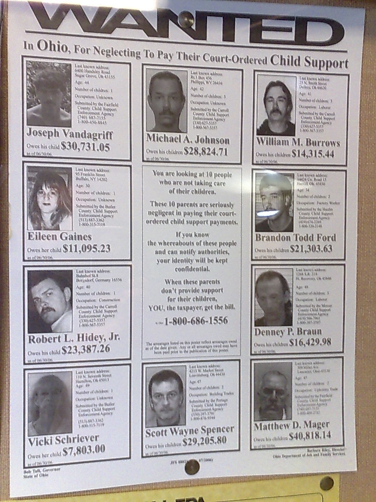 the wanted poster displayed on the wall