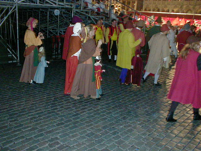 people wearing costumes standing in a group together