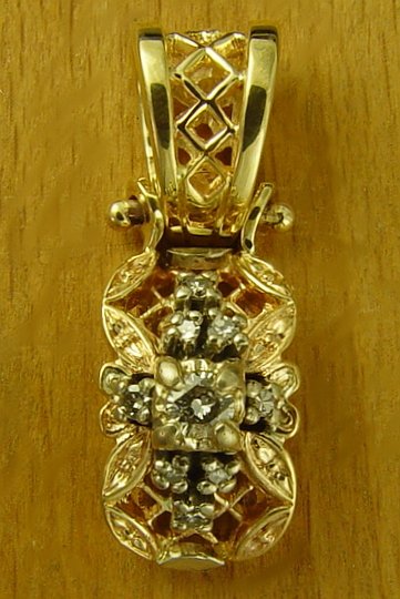 close up of a gold pendant with crystals