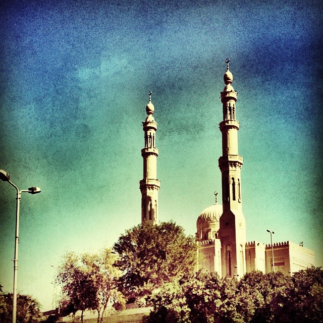 two tall buildings on the side of a city street