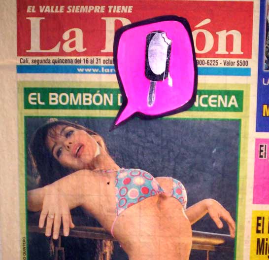 a woman in a bikini lies on a magazine