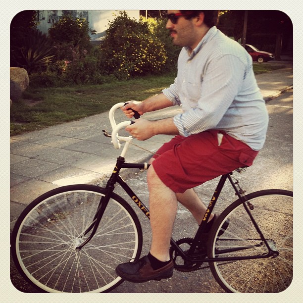 a man riding a bike on a street