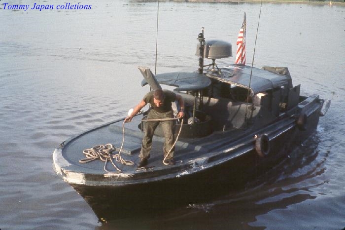 an image of a man in boat with a rope