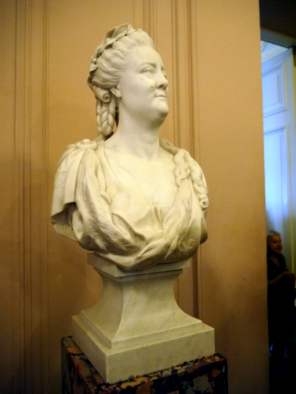 a white bust of a woman on display at the museum