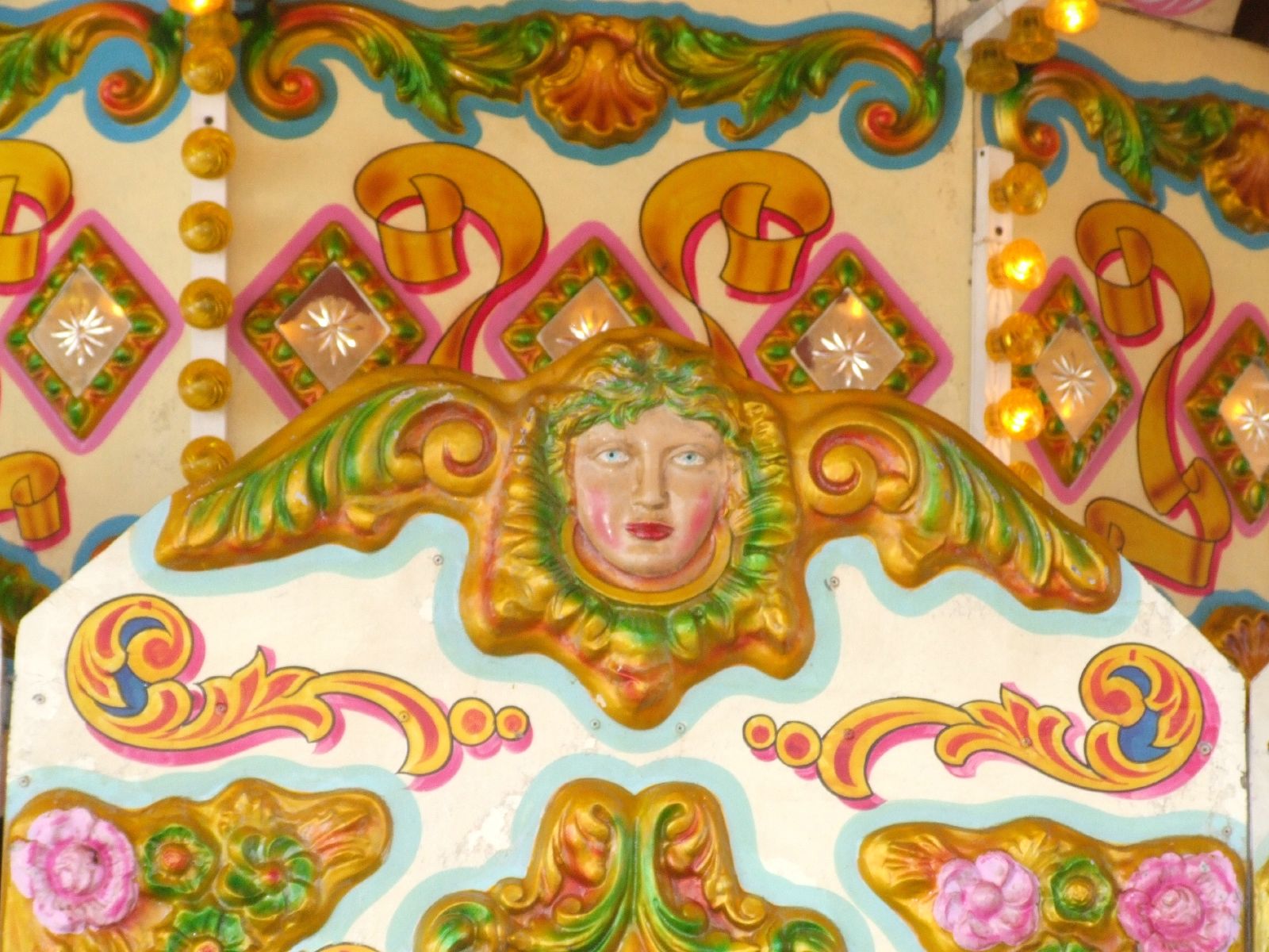 a decorative piece is shown on the sides of the carousel