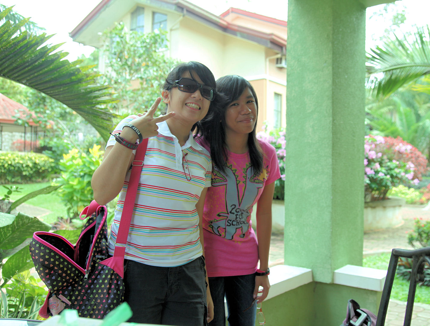 two women standing outside next to each other