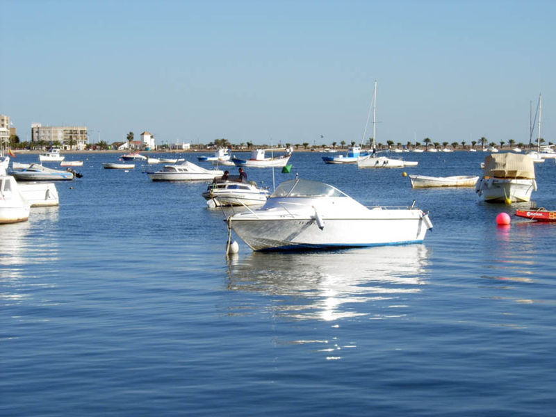 a bay with several boats sitting in the water