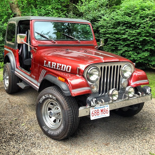 this jeep is very old and rusty red in color