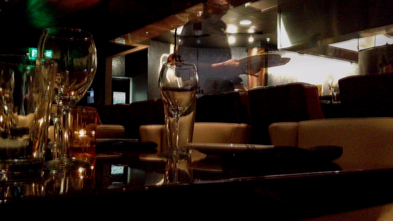 a black table filled with wine glasses sitting next to each other