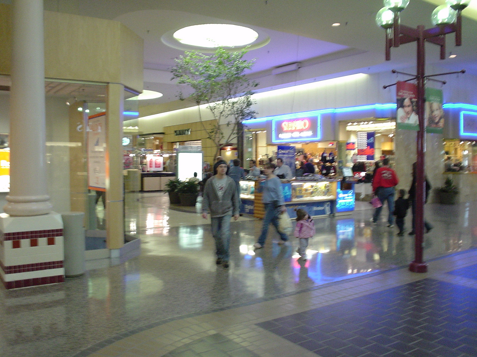 people walk down the lobby in a shopping mall