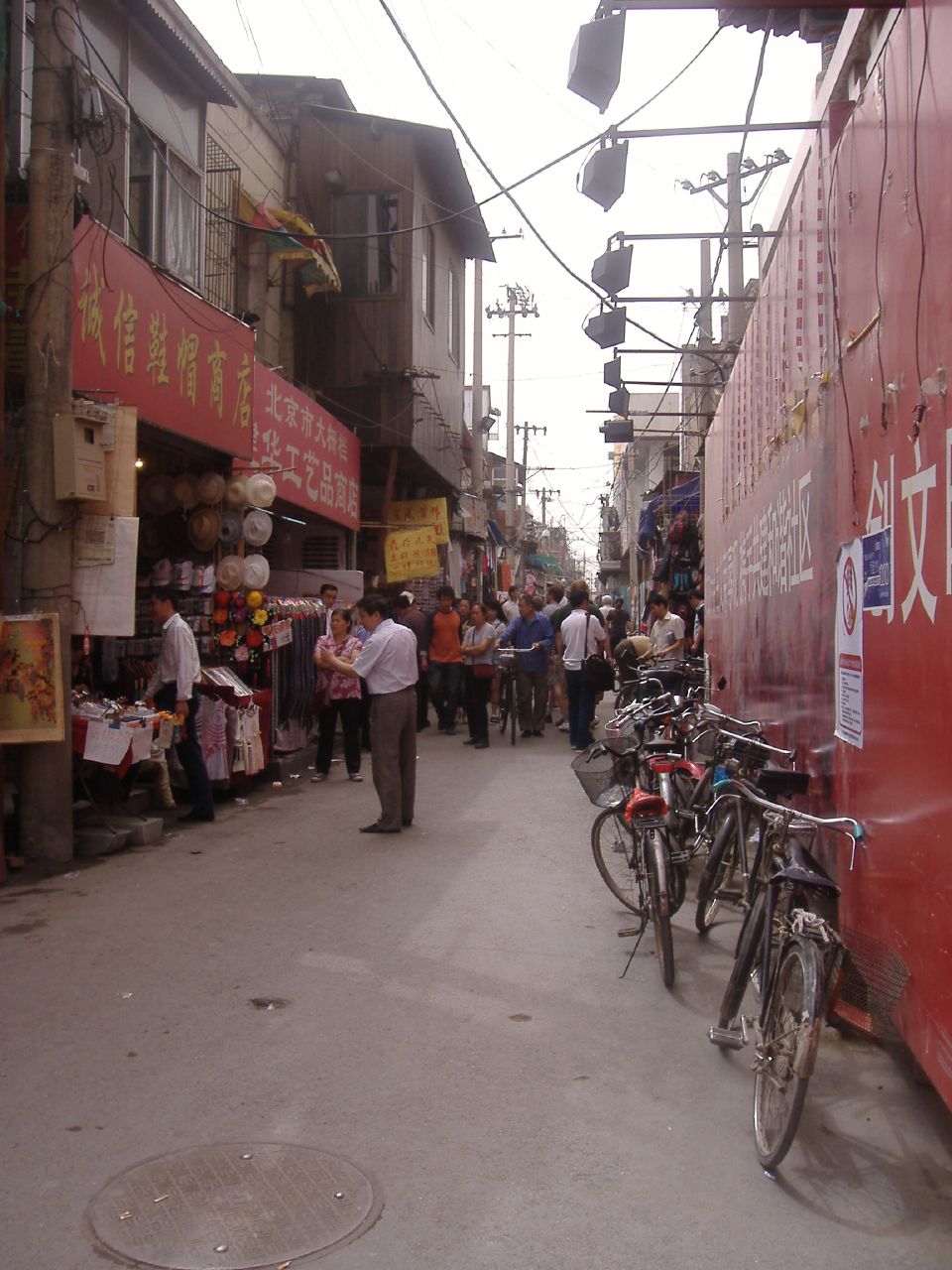 there are people walking down this street on this city