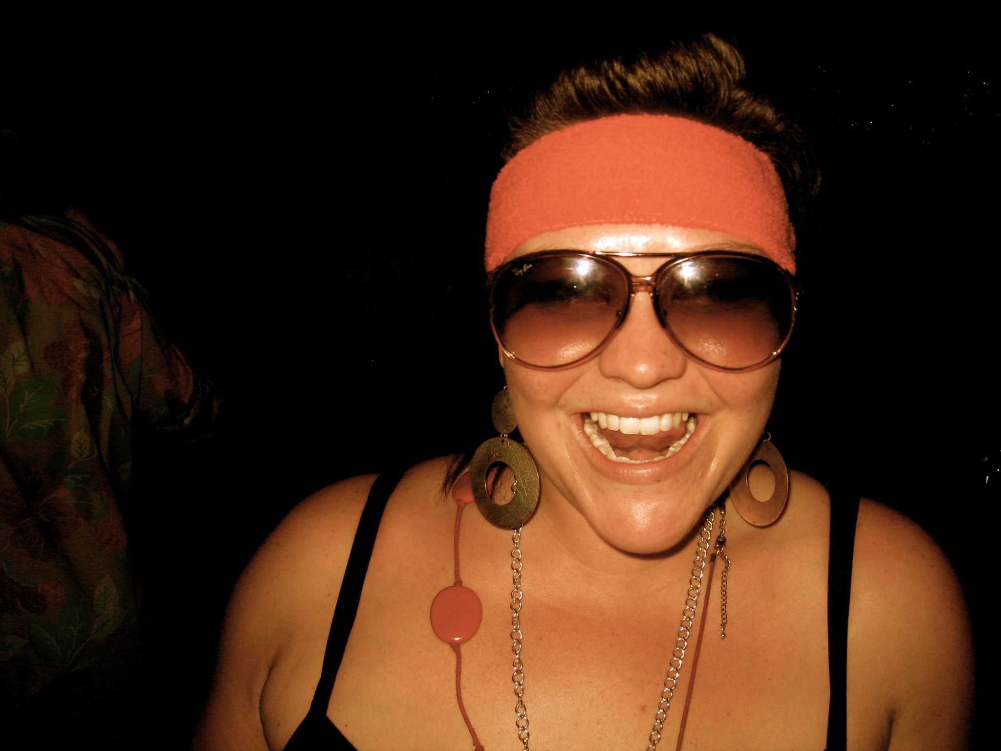 a woman with sunglasses on top of her head