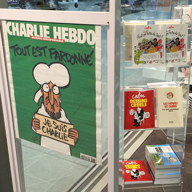 a window with a display case and various cartoon books