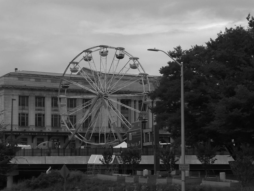 a black and white pograph of a giant ferris wheel