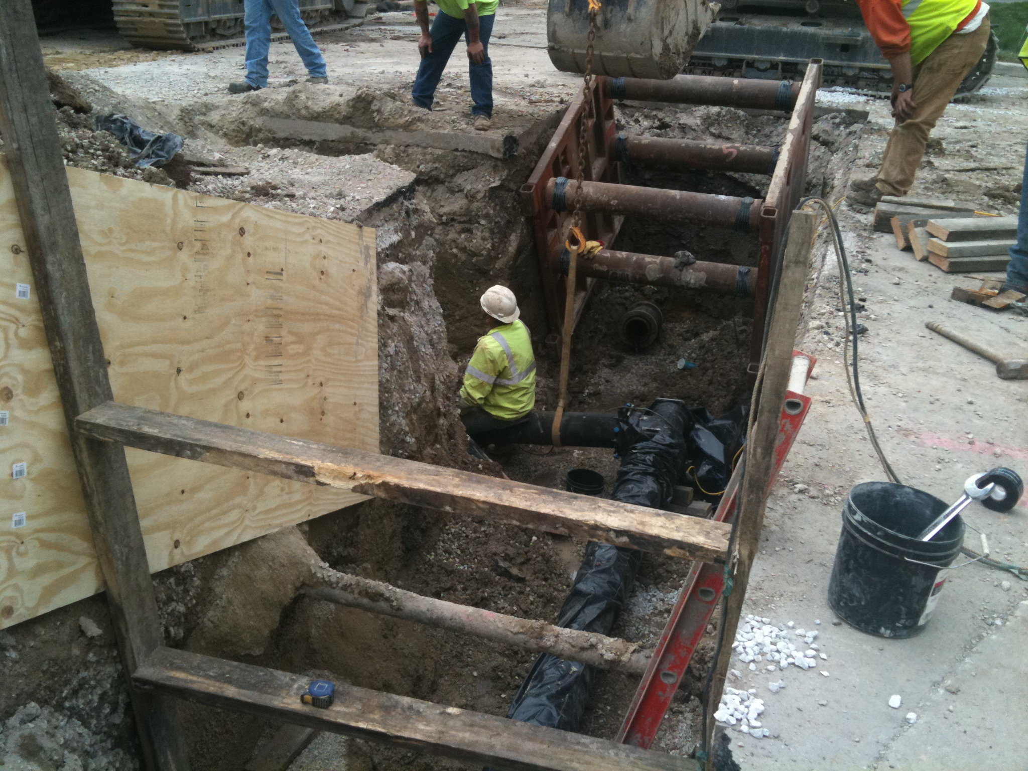 workers are working on the construction site of a house