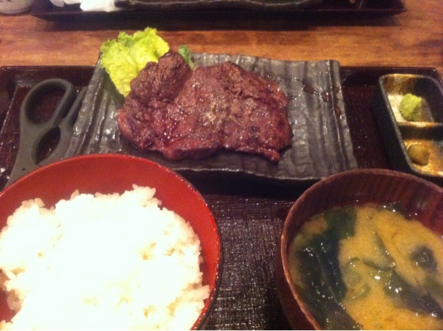 the large beef chopsticks are served with rice and broccoli