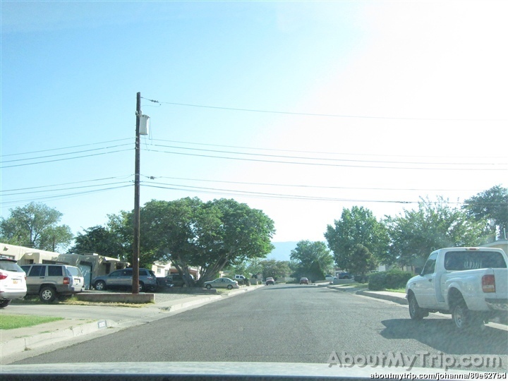 a truck is parked by the curb in an intersection