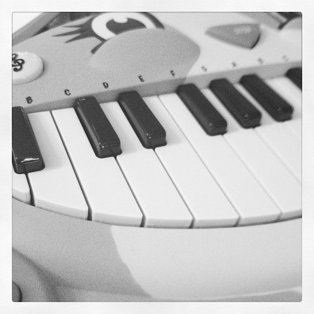 a black and white po of a piano
