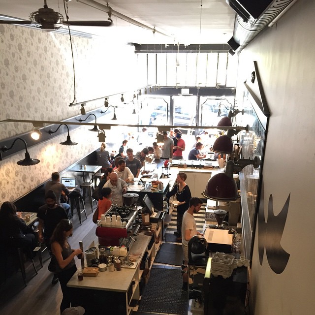 a very large dining area with all people eating
