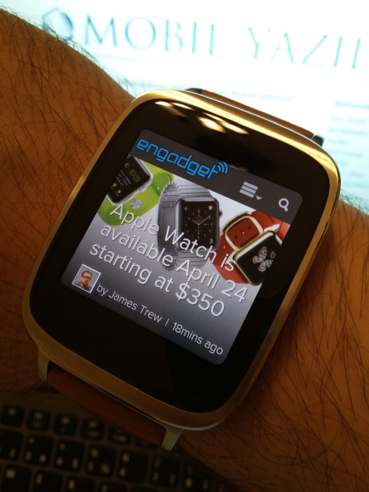a smart watch displaying a news feature on the screen