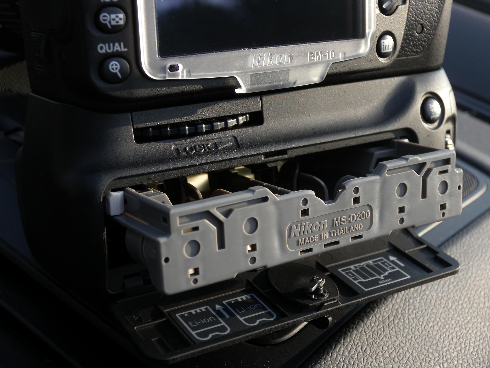 a car dashboard with a tv and electrical wiring