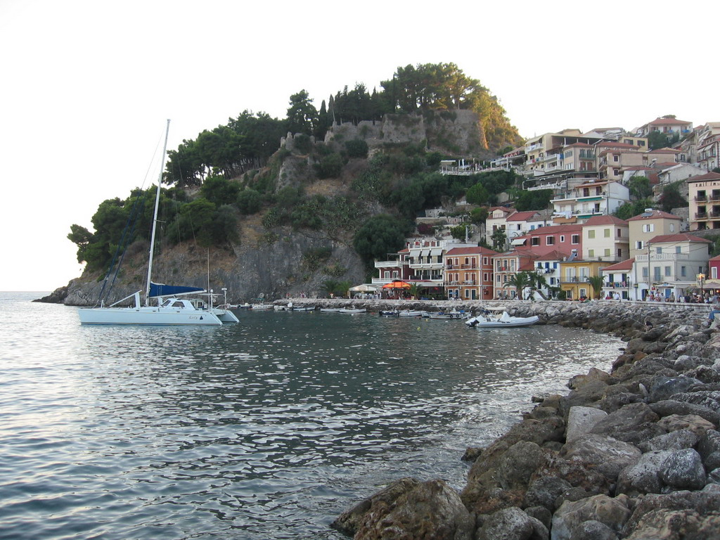 a harbor filled with a row of small sail boats