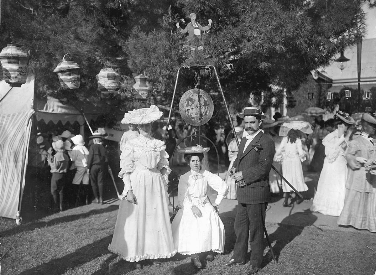 two people standing next to each other on a field