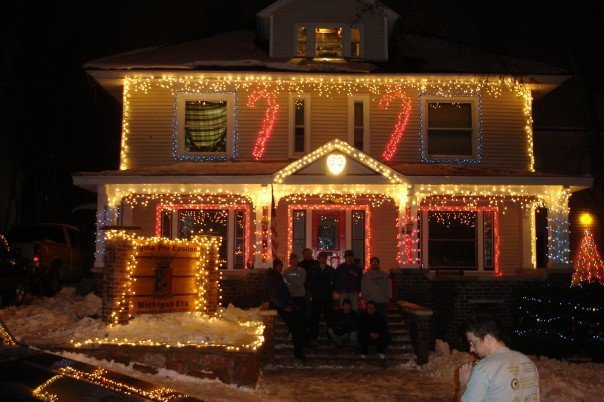 a home with several holiday lights lit up on the front of it